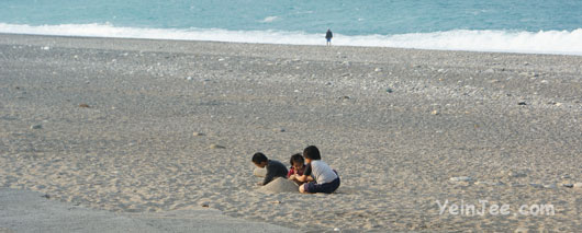 Kids playing at Qisingtan near Hualian city, Taiwan