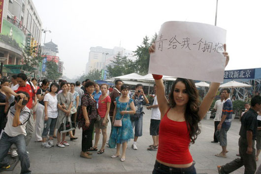 A lady offering free hugs in Beijing, China