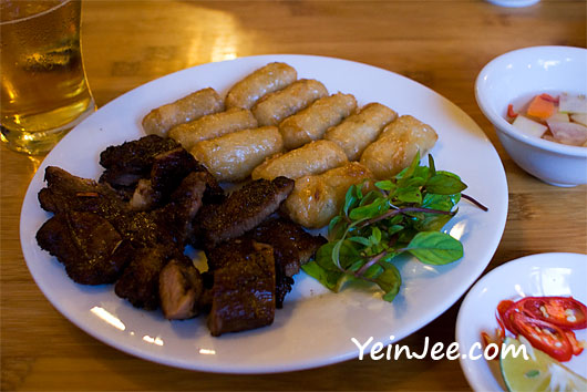 Sticky rice rolls and roast pork at Quan Com Pho restaurant in Hanoi, Vietnam