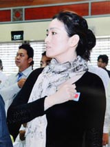 Chinese actress Gong Li taking an oath to become Singaporean