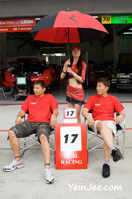 Japanese racers Toshihiro Kaneishi, Katsutomo Kaneishi and race queen Reiko Miyashita at Super GT Malaysia 2008