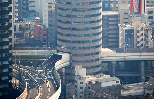 Picture of Gate Tower Building in Osaka, Japan, with a drive through highway