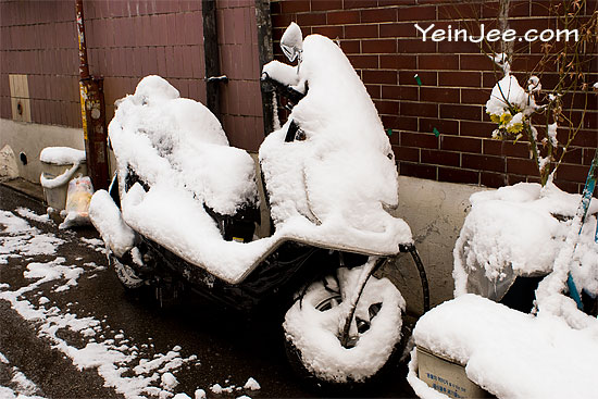 Motorbike covered in snow, Seoul